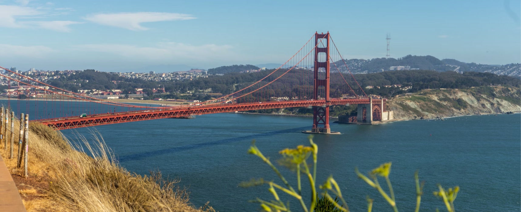 Golden Gate Bridge spanning San Francisco Bay with coastal hills in the background