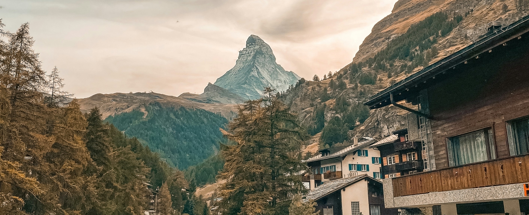 View of the Matterhorn above alpine village buildings in Zermatt, Switzerland